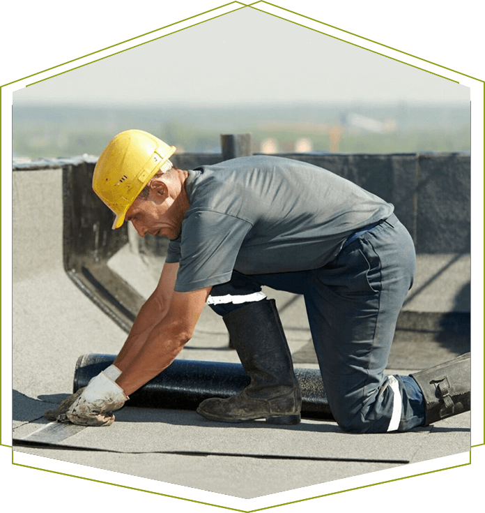 A man working on the roof of a building.